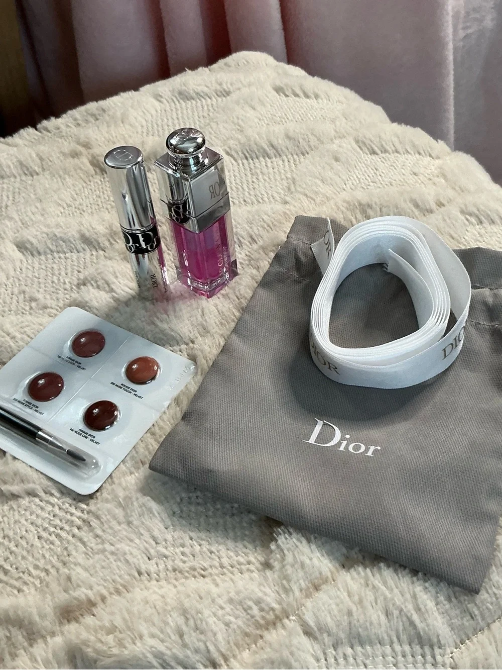 Dior White Logo Ribbon with Gray Pouch and Pink Lip Gloss Accent